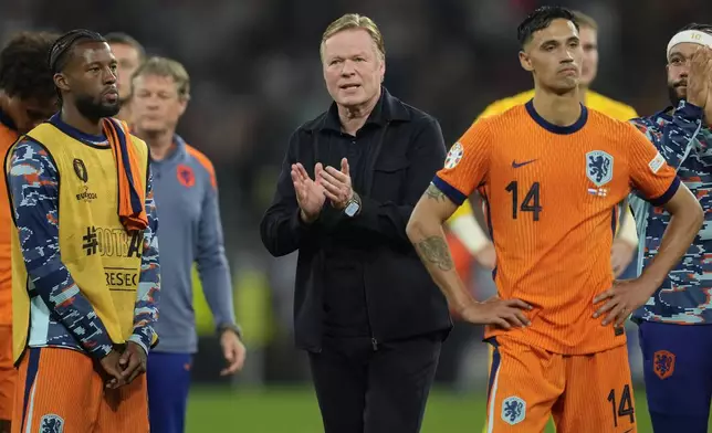 Netherlands head coach Ronald Koeman applauds supporters after a semifinal match between the Netherlands and England at the Euro 2024 soccer tournament in Dortmund, Germany, Wednesday, July 10, 2024. England won 2-1. (AP Photo/Darko Vojinovic)