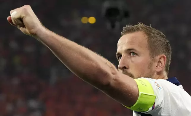 England's Harry Kane celebrates after scoring his sides first goal during a semifinal match between the Netherlands and England at the Euro 2024 soccer tournament in Dortmund, Germany, Wednesday, July 10, 2024. (AP Photo/Frank Augstein)