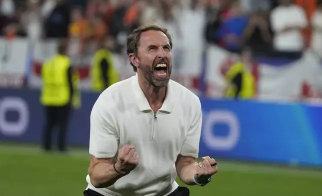 England's manager Gareth Southgate celebrates at the end of a semifinal against Netherlands at the Euro 2024 soccer tournament in Dortmund, Germany, Wednesday, July 10, 2024. England won the game 2-1. (AP Photo/Thanassis Stavrakis)