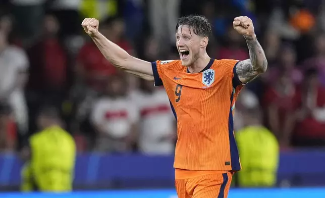 Wout Weghorst of the Netherlands celebrates after the end of the quarterfinal match between the Netherlands and Turkey at the Euro 2024 soccer tournament in Berlin, Germany, Saturday, July 6, 2024. The Netherlands won the game 2-1. (AP Photo/Matthias Schrader)