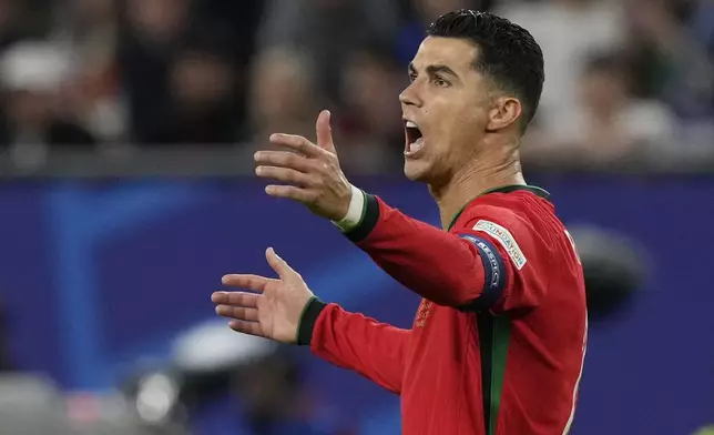 Portugal's Cristiano Ronaldo reacts after a call during a quarter final match between Portugal and France at the Euro 2024 soccer tournament in Hamburg, Germany, Friday, July 5, 2024. (AP Photo/Frank Augstein)