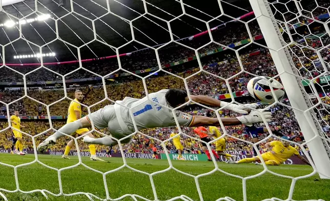 Romania's goalkeeper Florin Nita fails to block a shot on goal by Cody Gakpo of the Netherlands during a round of sixteen match between Romania and the Netherlands at the Euro 2024 soccer tournament in Munich, Germany, Tuesday, July 2, 2024. (AP Photo/Antonio Calanni)