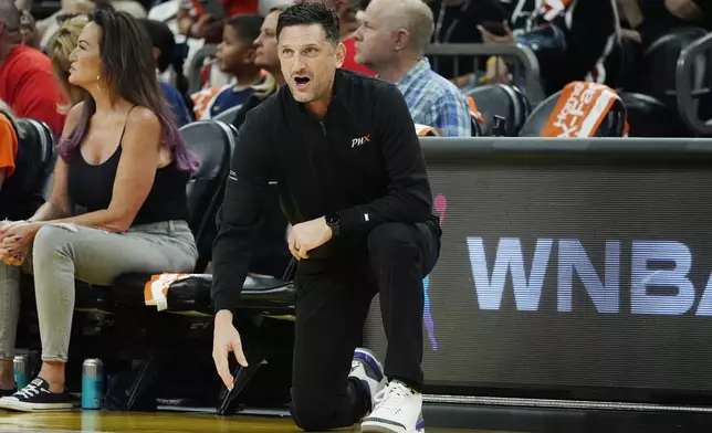 Phoenix Mercury head coach Nate Tibbetts shouts instructions during the first half of a WNBA basketball game against the Indiana Fever, Sunday, June 30, 2024, in Phoenix. The Fever won 88-82. (AP Photo/Ross D. Franklin)