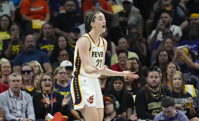 Indiana Fever guard Caitlin Clark reacts after being called for a foul against the Phoenix Mercury during the first half of a WNBA basketball game Sunday, June 30, 2024, in Phoenix. (AP Photo/Ross D. Franklin)