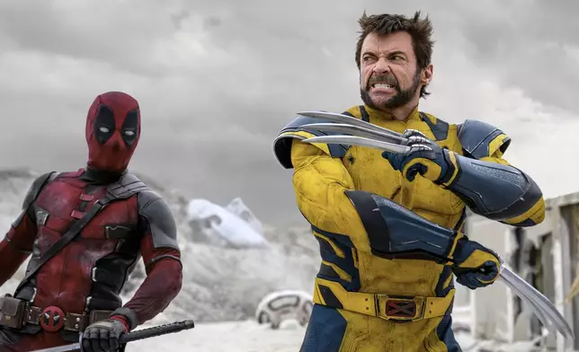 This image released by 20th Century Studios/Marvel Studios shows Ryan Reynolds as Deadpool/Wade Wilson, left, and Hugh Jackman as Wolverine/Logan in a scene from "Deadpool &amp; Wolverine." (20th Century Studios/Marvel Studios via AP)