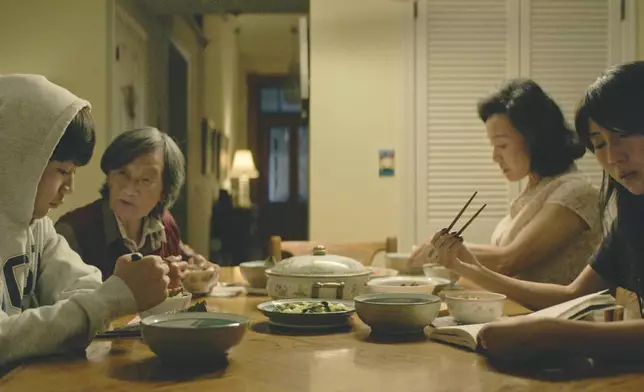 This image released by Focus Features shows Izaac Wang, Chang Li Hua, Joan Chen and Shirley Chen in a scene from "DÌDI." (Focus Features via AP)