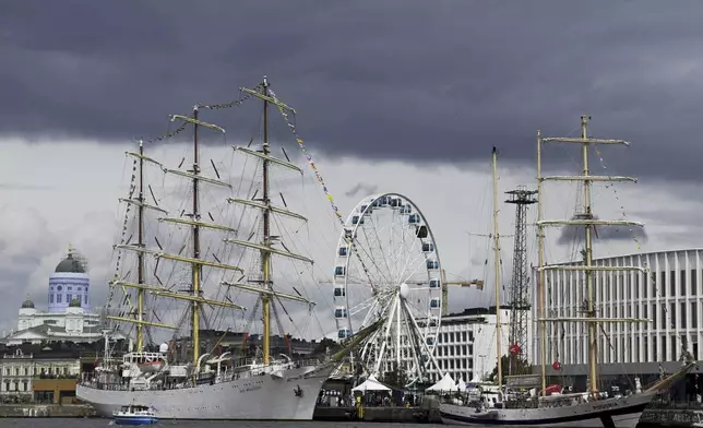 Polish ship Dar Mlodziezy (left) and Pogoria during the opening day of the Tall Ships Races event in Helsinki, Finland, Thursday July 4, 2024. Dozens of impressive classic sailing vessels from 13 different countries currently plying the Baltic Sea arrived at the Finnish capital on Thursday at the end of the first leg of the Tall Ships Races that kicked off from the Lithuanian port city of Klaipeda late June. (Aada Pet'j'/Lehtikuva via AP)
