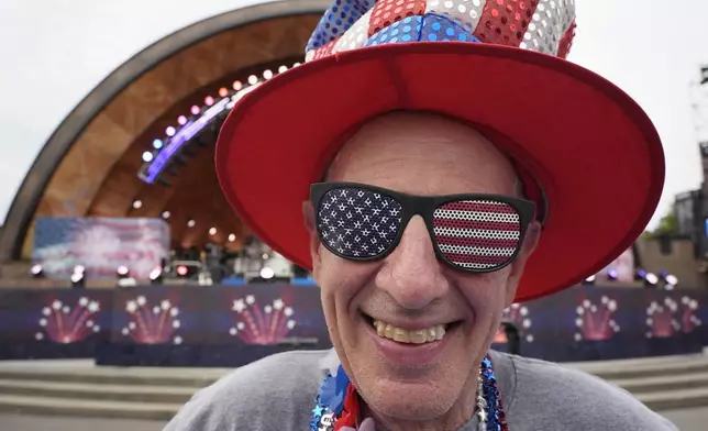 Doc Rutstein, of Braintree, Mass., poses for a photo before the Boston Pops Fireworks Spectacular at the Hatch Memorial Shell on the Esplanade in Boston, Thursday, July 4, 2024. (AP Photo/Michael Dwyer)