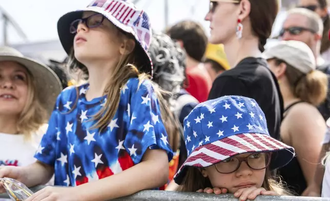 People wait for the Nathan's Famous Fourth of July hot dog eating contest to start, Thursday, July 4, 2024 at Coney Island in the Brooklyn borough of New York. (AP Photo/Julia Nikhinson)