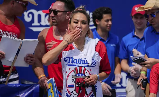 Miki Sudo reacts after winning the women's of the Nathan's Famous Fourth of July hot dog eating contest, Thursday, July 4, 2024, at Coney Island in the Brooklyn borough of New York. (AP Photo/Julia Nikhinson)