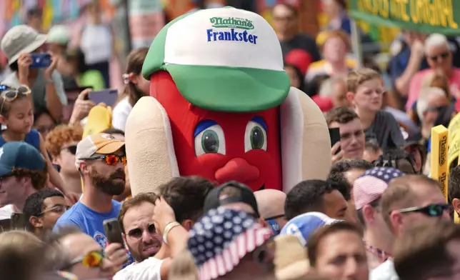 Nathan's Frankster mascot looks on during Nathan's Famous Fourth of July hot dog eating contest, Thursday, July 4, 2024, at Coney Island in the Brooklyn borough of New York. (AP Photo/Julia Nikhinson)