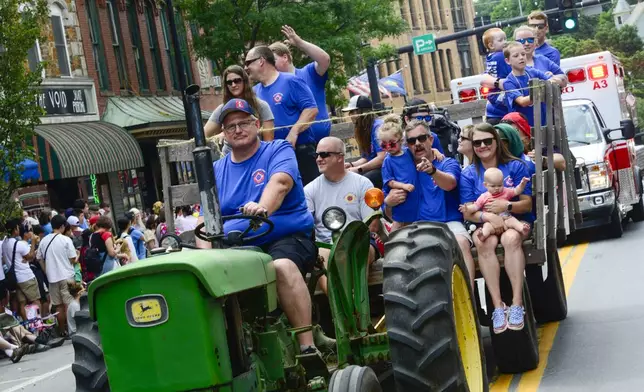 People filled Main Street in Brattleboro, Vt., to watch the annual Fourth of July parade on Thursday, July, 4, 2024. (Kristopher Radder/The Brattleboro Reformer via AP)