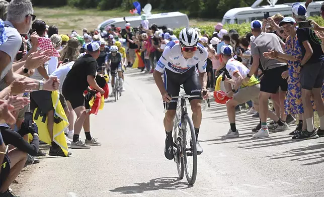 Belgium's Remco Evenepoel rides breakaway on a gravel road during the ninth stage of the Tour de France cycling race over 199 kilometers (123.7 miles) with start and finish in Troyes, France, Sunday, July 7, 2024. (Bernard Papon/Pool Photo via AP)