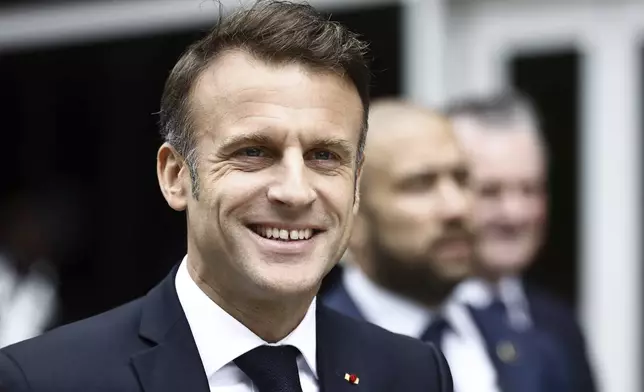 French President Emmanuel Macron arrives to vote for the second round of the legislative elections in Le Touquet-Paris-Plage, northern France, Sunday July 7 2024. Voting has begun in mainland France on Sunday in pivotal runoff elections that could hand a historic victory to Marine Le Pen's far-right National Rally and its inward-looking, anti-immigrant vision — or produce a hung parliament and political deadlock. (Mohammed Badra, Pool via AP)