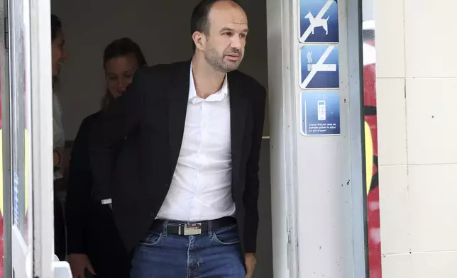 Far-left France Unbowed party member Manuel Bompard arrives to meet reporters outside the party headquarters Monday, July 8, 2024 in Paris. French President Emmanuel Macron rejected the resignation of Prime Minister Gabriel Attal Monday, in the wake of a chaotic election result that left neither left, right, nor center with a majority in the National Assembly. (AP Photo/Aurelien Morissard)