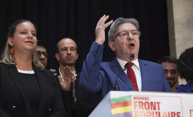 Far-left La France Insoumise - LFI - (France Unbowed) founder Jean-Luc Melenchon delivers a speech at the party election night headquarters, Sunday, July 7, 2024 in Paris. A coalition on the left that came together unexpectedly ahead of France's snap elections won the most parliamentary seats in the vote, according to polling projections Sunday. The surprise projections put President Emmanuel Macron's centrist alliance in second and the far right in third. At left is LFI's Mathilde Pant and at center Manuel Bompard. (AP Photo/Thomas Padilla)