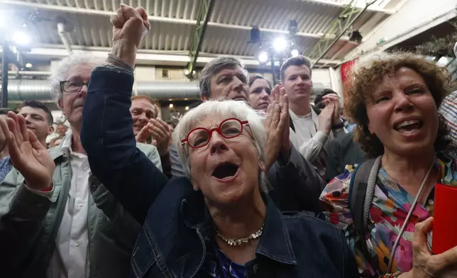 Supporters of the Socialist Party react after the second round of the legislative elections, Sunday, July 7, 2024 at their election night headquarters in Paris. A coalition on the left that came together unexpectedly ahead of France's snap elections won the most parliamentary seats in the vote, according to polling projections Sunday. The surprise projections put President Emmanuel Macron's centrist alliance in second and the far right in third. (AP Photo/Aurelien Morissard)