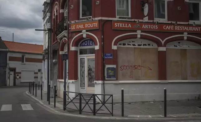 A closed shop is pictured near the railway station of Henin-Beaumont, northern France, Sunday, June 30, 2024. A depressed former mining town is at the heart of French far-right leader Marine Le Pen's long-term political strategy. Her party's electoral success Sunday came as no surprise to the hundreds of fierce supporters who had gathered in the town of Henin-Beaumont to see her victory speech. (AP Photo/Thibault Camus)