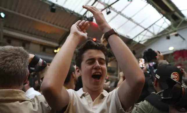 Supporters of the Socialist Party react after the second round of the legislative elections, Sunday, July 7, 2024 at their election night headquarters in Paris. A coalition on the left that came together unexpectedly ahead of France's snap elections won the most parliamentary seats in the vote, according to polling projections Sunday. The surprise projections put President Emmanuel Macron's centrist alliance in second and the far right in third. (AP Photo/Aurelien Morissard)