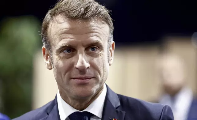 French President Emmanuel Macron is seen during the second round of the legislative elections in Le Touquet-Paris-Plage, northern France, Sunday July 7 2024. Voting has begun in mainland France on Sunday in pivotal runoff elections that could hand a historic victory to Marine Le Pen's far-right National Rally and its inward-looking, anti-immigrant vision — or produce a hung parliament and political deadlock. (Mohammed Badra, Pool via AP)