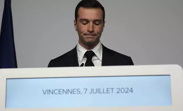 Far-right National Rally party president Jordan Bardella delivers a speech after the second round of the legislative election, Sunday, July 7, 2024 at the party election night headquarters in Paris. A coalition on the left that came together unexpectedly ahead of France's snap elections won the most parliamentary seats in the vote, according to polling projections Sunday. The surprise projections put President Emmanuel Macron's centrist alliance in second and the far right in third. (AP Photo/Louise Delmotte)