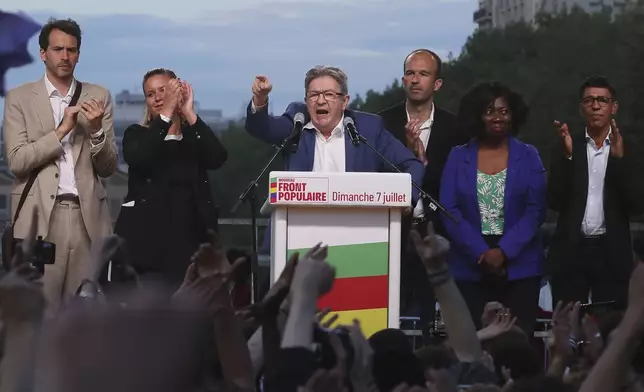 Far-left La France Insoumise - LFI - (France Unbowed) founder Jean-Luc Melenchon, center, delivers a speech after the second round of the legislative elections Sunday, July 7, 2024 in Paris. A coalition on the left that came together unexpectedly ahead of France's snap elections won the most parliamentary seats in the vote, according to polling projections Sunday. The surprise projections put President Emmanuel Macron's centrist alliance in second and the far right in third. (AP Photo/Thomas Padilla)