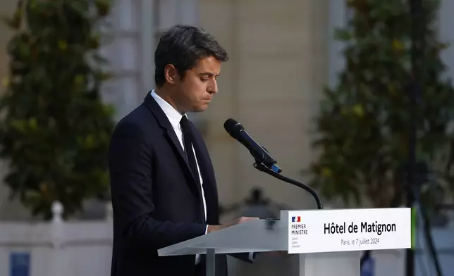 French Prime Minister Gabriel Attal delivers a speech after the second round of the legislative elections, Sunday, July 7, 2024 in Paris. A coalition of the French left that quickly banded together to beat a surging far right in legislative elections won the most seats in parliament but not a majority, according to polling projections Sunday, a stunning outcome that threatens to plunge the country into political and economic turmoil. (AP Photo/Aurelien Morissard)