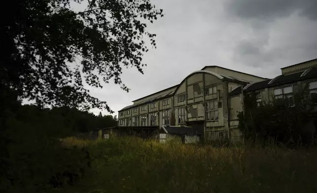 An abandoned pithead building is pictured in Henin-Beaumont, northern France, Sunday, June 30, 2024. A depressed former mining town is at the heart of French far-right leader Marine Le Pen's long-term political strategy. Her party's electoral success Sunday came as no surprise to the hundreds of fierce supporters who had gathered in the town of Henin-Beaumont to see her victory speech. (AP Photo/Thibault Camus)