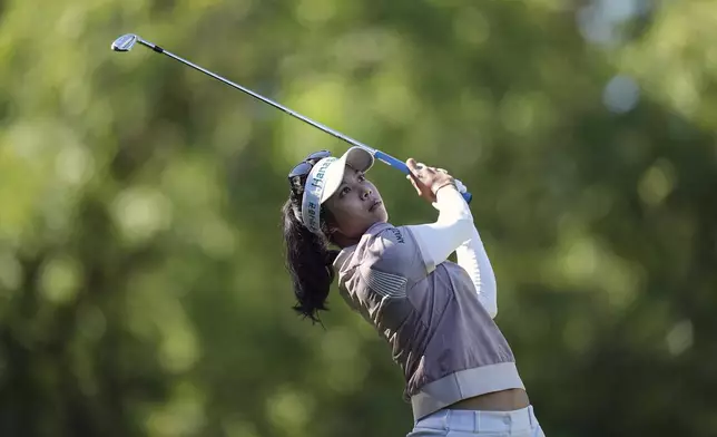 Patty Tavatanakit, of Thailand, plays on the 2nd hole during the last round of the Evian Championship women's golf tournament, in Evian, eastern France, Sunday, July 14, 2024. (AP Photo/Laurent Cipriani)