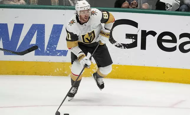 FILE - Vegas Golden Knights' Jonathan Marchessault controls the puck in Game 5 of an NHL hockey Stanley Cup first-round playoff series against the Dallas Stars in Dallas, May 1, 2024. Hundreds of millions of dollars will be committed to free agents, including a strong crop of forwards led by longtime Tampa Bay captain Steven Stamkos, three-time Stanley Cup champion Patrick Kane and 2023 playoff MVP Marchessault. (AP Photo/Tony Gutierrez, File)