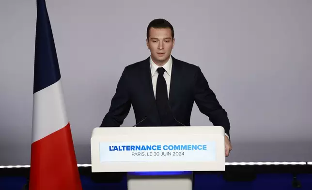 FILE - Far-right National Rally party president Jordan Bardella delivers his speech after the first round vote of the legislative election, Sunday, June 30, 2024 in Paris. After France’s far-right National Rally surged into the lead in the first round of legislative elections, some European neighbors are warily eyeing the latest country on the continent to veer to the right. (AP Photo/Aurelien Morissard, File)