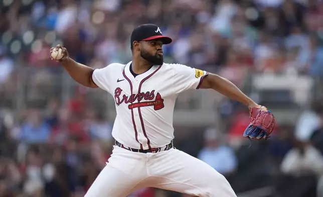Atlanta Braves pitcher Reynaldo López (40) delivers in the first inning of a baseball game against the San Francisco Giants, Tuesday, July 2, 2024, in Atlanta. (AP Photo/Brynn Anderson)