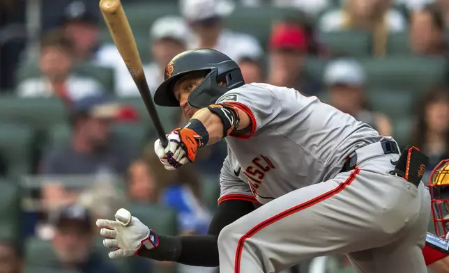 San Francisco Giants' Nick Ahmed grounds out during the fifth inning of a baseball game against the Atlanta Braves, Thursday, July 4, 2024, in Atlanta. (AP Photo/Jason Allen)