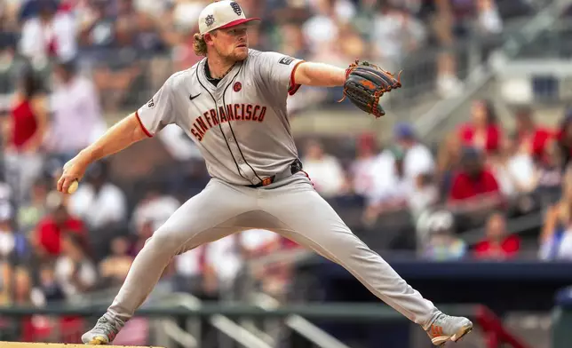 San Francisco Giants pitcher Logan Webb throws during the first inning of a baseball game against the Atlanta Braves, Thursday, July 4, 2024, in Atlanta. (AP Photo/Jason Allen)