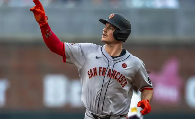 San Francisco Giants Matt Chapman rounds second base after hitting a home run to center field during the fourth inning of a baseball game against the Atlanta Braves, Thursday, July 4, 2024, in Atlanta. (AP Photo/Jason Allen)
