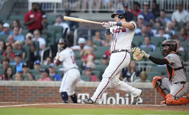 Atlanta Braves' Sean Murphy (12) hits a solo home run in the second inning of a baseball game against the San Francisco Giants, Tuesday, July 2, 2024, in Atlanta. (AP Photo/Brynn Anderson)
