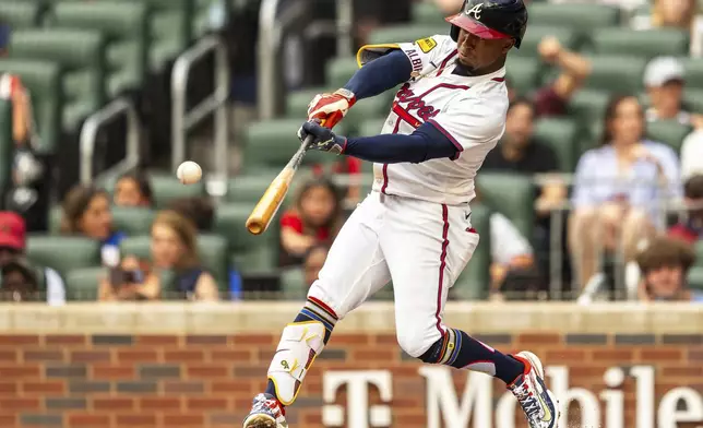 Atlanta Braves' Ozzie Albies hits a single during the first inning of a baseball game against the San Francisco Giants, Thursday, July 4, 2024, in Atlanta. (AP Photo/Jason Allen)