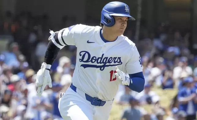 Los Angeles Dodgers designated hitter Shohei Ohtani (17) runs to first on a double during the fourth inning of a baseball game against the San Francisco Giantscin Los Angeles, Calif., Thursday, July 25, 2024. (AP Photo/Eric Thayer)