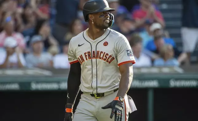 San Francisco Giants' Jorge Soler walks back to the dugout after striking out against Cleveland Guardians relief pitcher Hunter Gaddis during the eighth inning of a baseball game in Cleveland, Saturday, July 6, 2024. (AP Photo/Phil Long)