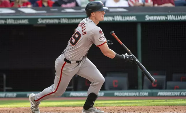 San Francisco Giants' Tyler Fitzgerald heads to first base with an RBI single off Cleveland Guardians relief pitcher Scott Barlow during the fifth inning of a baseball game in Cleveland, Saturday, July 6, 2024. (AP Photo/Phil Long)