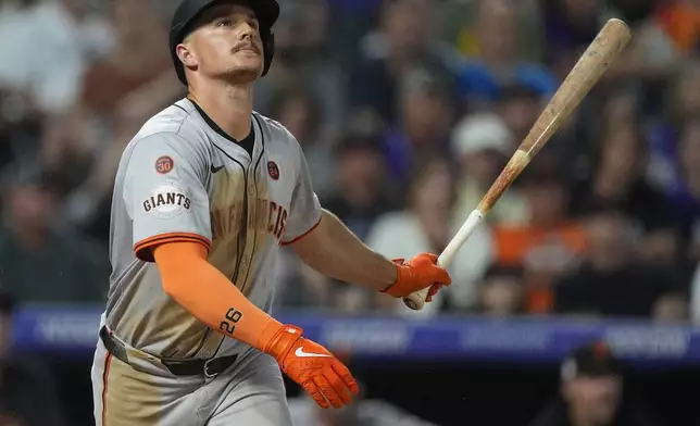 San Francisco Giants' Matt Chapman flies out against Colorado Rockies relief pitcher Victor Vodnik in the ninth inning of a baseball game ,Saturday, July 20, 2024, in Denver. (AP Photo/David Zalubowski)