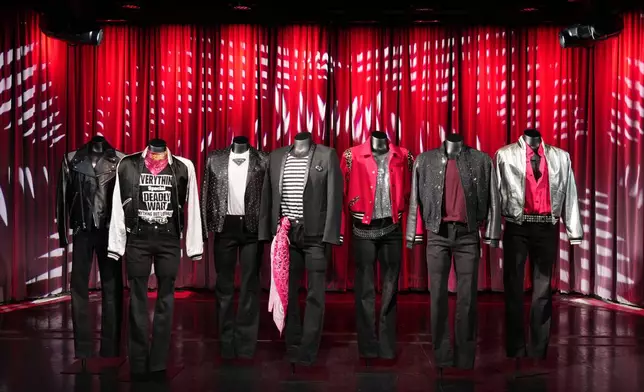 Outfits worn by the Korean pop group ENHYPEN for their "Sweet Venom" music video are previewed at the K-pop HYBE Exhibit at the Grammy Museum, Friday, June 28, 2024, in Los Angeles. (AP Photo/Chris Pizzello)