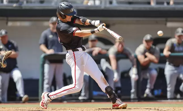 FILE - Georgia's Charlie Condon hits the ball during an NCAA regional baseball game against Army on May 31, 2024 in Athens, Ga. The Cleveland Guardians have the No. 1 overall pick in next week's draft. They have narrowed the talent pool to just a few possibilities with Oregon State second baseman Travis Bazzana, Georgia outfielder/third baseman Condon and West Virginia middle infielder Wetherholt believed to be the frontrunning options. (AP Photo/Stew Milne, File)