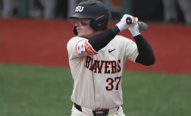 FILE - Oregon State infielder Travis Bazzana bats during an NCAA baseball game against Arizona State on April 6, 2024, in Corvallis, Ore. The Cleveland Guardians have the No. 1 overall pick in next week's draft. They have narrowed the talent pool to just a few possibilities with Oregon State second baseman Bazzana, Georgia outfielder/third baseman Charlie Condon and West Virginia middle infielder Wetherholt believed to be the frontrunning options. (AP Photo/Amanda Loman, File)