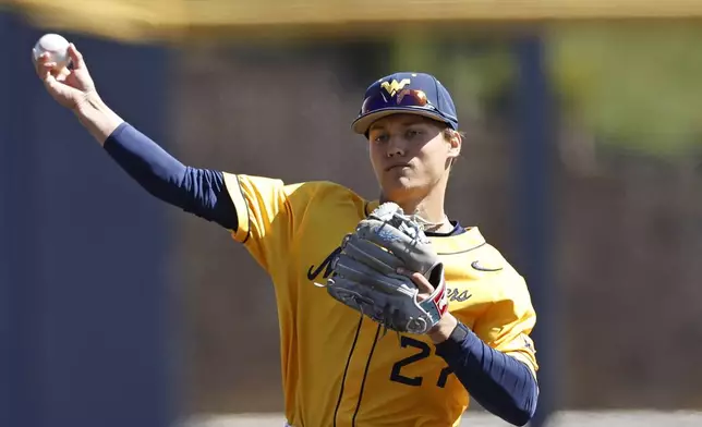 FILE - West Virginia's JJ Wetherholt in action against Xavier during an NCAA baseball game on March 26, 2023, in Morgantown, W. Va. The Cleveland Guardians have the No. 1 overall pick in next week's draft. They have narrowed the talent pool to just a few possibilities with Oregon State second baseman Travis Bazzana, Georgia outfielder/third baseman Charlie Condon and West Virginia middle infielder Wetherholt believed to be the frontrunning options. (AP Photo/Gregory Payan, File)