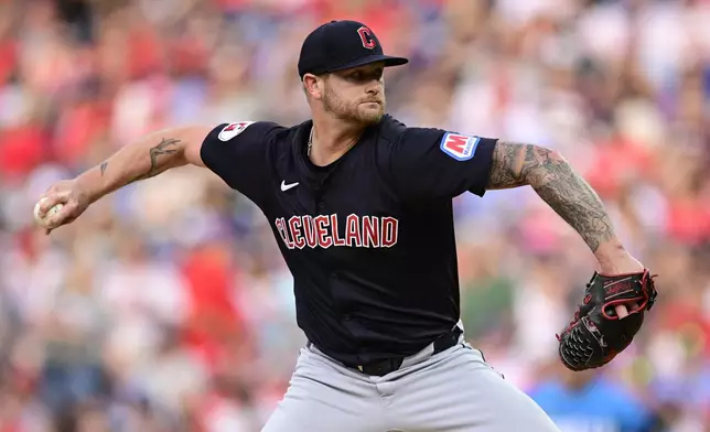 Cleveland Guardians' Ben Lively throws during the first inning of a baseball game against the Philadelphia Phillies, Friday, July 26, 2024, in Philadelphia. (AP Photo/Derik Hamilton)