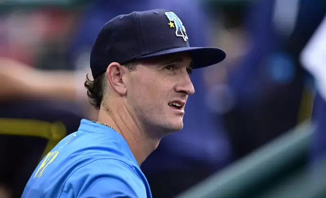 Philadelphia Phillies' Austin Hays sits in the dugout prior to a baseball game against the Cleveland Guardians, Friday, July 26, 2024, in Philadelphia. (AP Photo/Derik Hamilton)