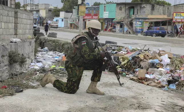 A Kenyan police officer patrols the area near the international airport in Port-au-Prince, Haiti, Wednesday, July 3, 2024. (AP Photo/Odelyn Joseph)
