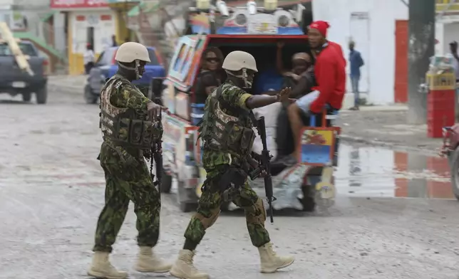 Kenyan police patrol the area near the international airport in Port-au-Prince, Haiti, Wednesday, July 3, 2024. (AP Photo/Odelyn Joseph)