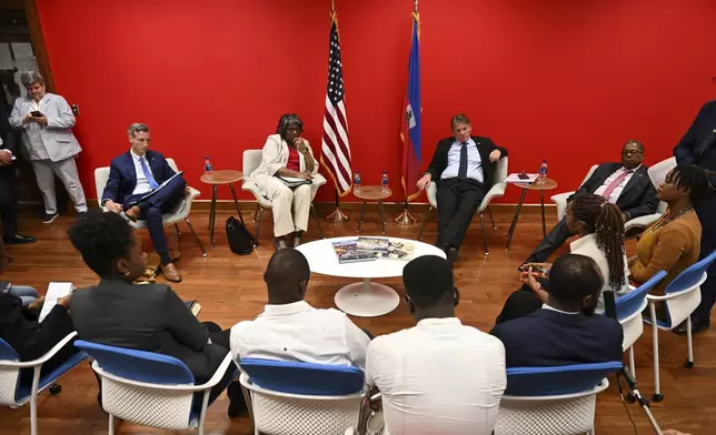 U.S. Ambassador to the United Nations Linda Thomas-Greenfield, top, center left, and U.S. Ambassador to Haiti Dennis Jankins, top, center right, meet with Haitian members of civil society at the U.S. embassy in Port-au-Prince, Haiti, Monday, July 22, 2024. (Roberto Schmidt/Pool via AP)